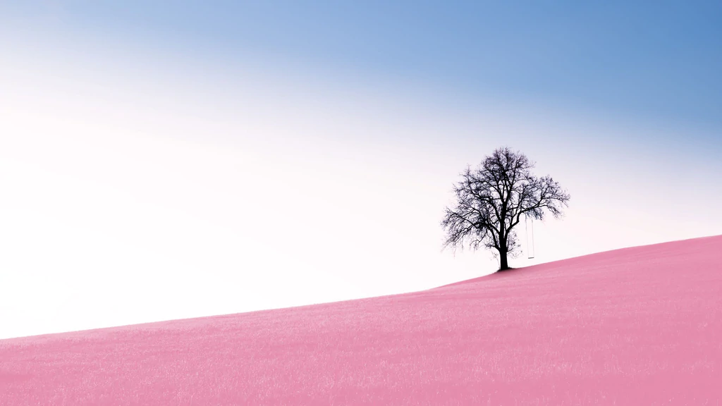 blue sky and pink land with a tree